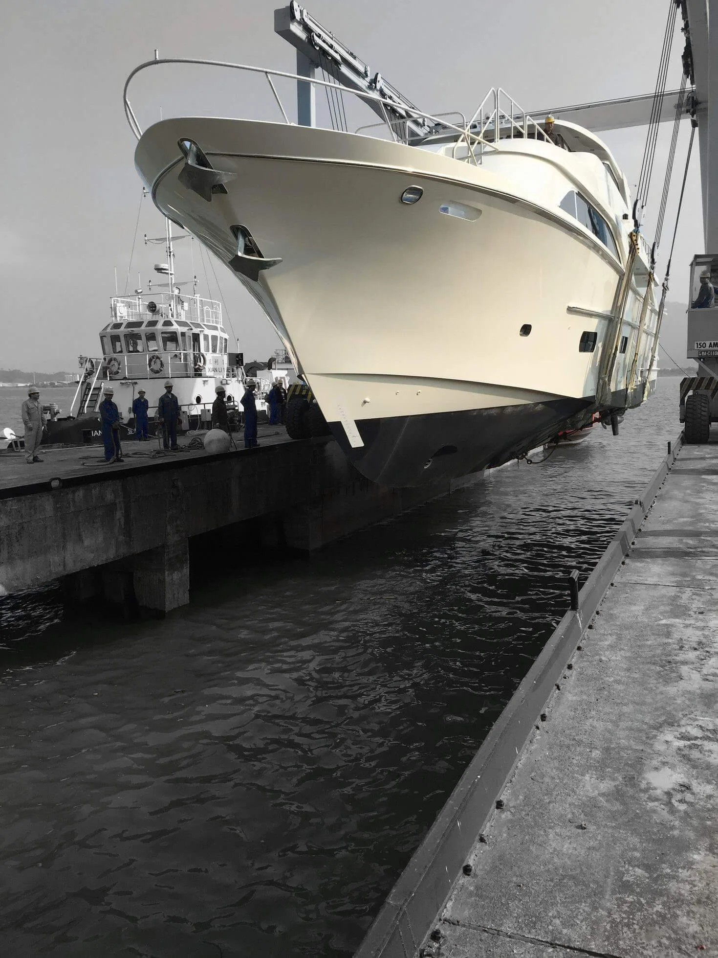 Yacht hull being lifted at the Hin Lee shipyard
