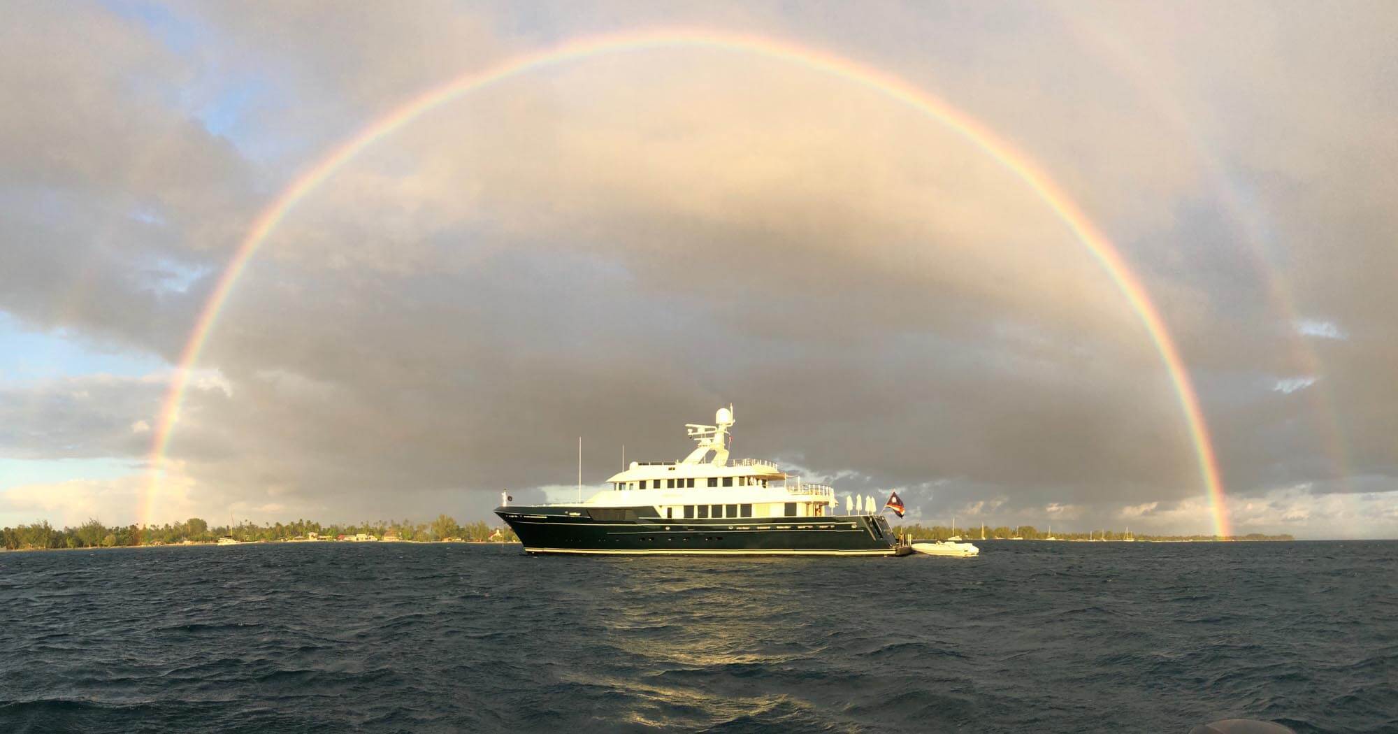 Best Explorer Yacht Dorothea III under a rainbow at Rangiroa Atoll in the Tuamoto Archipelago